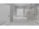 Elegant bathroom featuring a soaking tub, and glass-enclosed shower at 1104 Hobson Ct, Raleigh, NC 27607