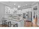 Modern kitchen featuring granite countertops, stainless steel appliances, and a breakfast bar at 1104 Hobson Ct, Raleigh, NC 27607