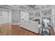 Open-concept living room boasts hardwood floors, coffered ceilings, and ample natural light at 1104 Hobson Ct, Raleigh, NC 27607