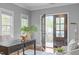 The office has an open door to a balcony with natural light and hardwood flooring at 1104 Hobson Ct, Raleigh, NC 27607