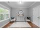 Cozy sitting room featuring hardwood floors, a window, and comfortable seating at 1104 Hobson Ct, Raleigh, NC 27607