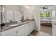 Elegant bathroom with double vanity, granite countertops, and access to the spacious, bright bedroom at 1108 Cadence Ln, Durham, NC 27703