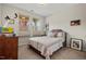Cozy bedroom features carpet, two windows offering natural light, and simple, comfortable furnishings at 1108 Cadence Ln, Durham, NC 27703