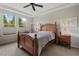 Cozy bedroom with a wooden bed frame, soft carpeting, and ambient lighting for a warm and inviting space at 1108 Cadence Ln, Durham, NC 27703