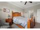 Comfortable bedroom with a wooden bed frame, soft lighting, and calming decor creating a relaxing atmosphere at 1108 Cadence Ln, Durham, NC 27703