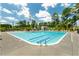 Large community pool with lap lanes and lounge chairs, surrounded by green trees under a blue sky at 1108 Cadence Ln, Durham, NC 27703