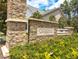 Stone sign for the Creekside at Bethpage community, surrounded by lush greenery and blue skies at 1108 Cadence Ln, Durham, NC 27703