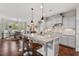 Bright kitchen featuring granite countertops, a breakfast bar, and stainless steel appliances at 1108 Cadence Ln, Durham, NC 27703