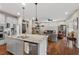 Spacious kitchen open to the living room with stone fireplace is great for entertaining at 1108 Cadence Ln, Durham, NC 27703