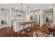 Open concept kitchen features a large island with seating and stainless steel appliances at 1108 Cadence Ln, Durham, NC 27703
