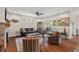 Comfortable living area with a stone fireplace, ceiling fan, and plenty of seating at 1108 Cadence Ln, Durham, NC 27703
