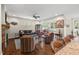 Inviting living area with a fireplace, comfortable seating, and an open layout to the kitchen at 1108 Cadence Ln, Durham, NC 27703