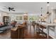 Open-concept living space featuring hardwood floors, stylish seating, and plenty of natural light at 1108 Cadence Ln, Durham, NC 27703