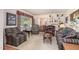 Bright living room with large window, bookshelves, and comfortable seating at 1108 Friendly Rd, Dunn, NC 28334