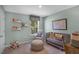 Adorable Bedroom with a crib, accent chair, and playful decorations at 1109 Ursa Major Ct, Wendell, NC 27591