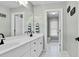 Bright bathroom featuring double vanity, white cabinetry, and tiled floor at 1113 Colonial Club Road Rd, Wake Forest, NC 27587