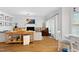 Open-concept living space boasts hardwood floors, comfortable seating, and a decorative fireplace at 1113 Colonial Club Road Rd, Wake Forest, NC 27587
