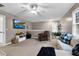 Large, carpeted living room with TV, ample seating and natural light at 1113 Colonial Club Road Rd, Wake Forest, NC 27587