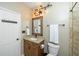 Updated bathroom featuring industrial-style lighting fixtures and granite vanity at 1114 Glenolden Ct, Cary, NC 27513