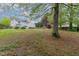 Expansive backyard with mature trees offers ample space for recreation and outdoor living at 112 Mendells Dr, Holly Springs, NC 27540