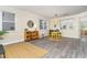 Comfortable living room boasts wood floors, stylish furniture, and natural light for a warm, inviting ambiance at 112 Mendells Dr, Holly Springs, NC 27540