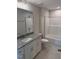 Bathroom with granite countertops, white cabinets, and tile flooring at 112 Surles Landing Way, Benson, NC 27504