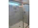 Modern bathroom featuring a glass-enclosed shower with tiled walls and a built-in niche at 112 Surles Landing Way, Benson, NC 27504