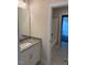 Bathroom vanity features granite countertop and framed mirror with modern lighting at 112 Surles Landing Way, Benson, NC 27504