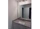Bathroom vanity features granite countertop and framed mirror with modern lighting at 112 Surles Landing Way, Benson, NC 27504
