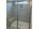 Modern bathroom featuring a glass-enclosed shower with tiled walls and a built-in bench at 112 Surles Landing Way, Benson, NC 27504