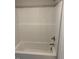 White bathtub with showerhead and tiled accents offers a clean, modern design at 112 Surles Landing Way, Benson, NC 27504