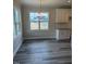 Bright dining space with large windows and hardwood floors at 112 Surles Landing Way, Benson, NC 27504