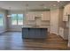 Open-concept kitchen featuring a large island with seating and modern appliances at 112 Surles Landing Way, Benson, NC 27504