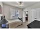 Comfortable bedroom features a cozy twin bed, neutral walls, and ample closet space at 115 Windy Creek Ln, Apex, NC 27502