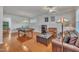 Spacious living room featuring a pool table, comfortable seating, and hardwood floors at 115 Windy Creek Ln, Apex, NC 27502