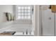 Serene main bathroom boasts a large soaking tub, shower with glass door, and stylish towel racks at 115 Windy Creek Ln, Apex, NC 27502
