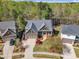Beautiful aerial view of the home showcasing professional landscaping, large driveway, and a two-car garage at 116 Palermo Ct, Apex, NC 27539