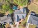 Expansive aerial view of the property showcasing its well-maintained landscape, private pool, and serene surroundings at 116 Palermo Ct, Apex, NC 27539