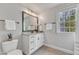 Bright bathroom featuring a vanity, a mirror, and tile floors at 116 Palermo Ct, Apex, NC 27539