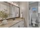 Bright bathroom featuring granite countertops and a large mirror at 116 Palermo Ct, Apex, NC 27539