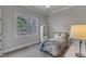Cozy bedroom featuring a soft rug, large window and neutral paint at 116 Palermo Ct, Apex, NC 27539