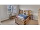 Cheerful bedroom with built-in shelving and under bed storage at 116 Palermo Ct, Apex, NC 27539