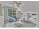 Bright bedroom showcasing a window, a sofa, a chair, and built-in shelving at 116 Palermo Ct, Apex, NC 27539