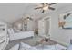 Vaulted bedroom showcasing carpeted floors, multiple ceiling fans, and built-in vanity at 116 Palermo Ct, Apex, NC 27539