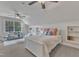 Bright primary bedroom featuring carpeted floors, cozy furniture, and built-in shelving at 116 Palermo Ct, Apex, NC 27539
