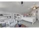 Bright bedroom featuring cozy chair, integrated shelving, and plush carpeting at 116 Palermo Ct, Apex, NC 27539