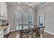 Charming dining area features three large windows offering lots of natural light and views at 116 Palermo Ct, Apex, NC 27539