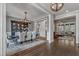Spacious dining room with modern lighting, elegant seating, and a stylish display cabinet, ideal for entertaining guests at 116 Palermo Ct, Apex, NC 27539
