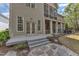 Back exterior showcasing a multi-level deck, patio, and landscaped yard with stone pathway at 116 Palermo Ct, Apex, NC 27539