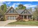 Charming home boasts stone accents, a well-manicured lawn, and a cozy front porch, enhancing its curb appeal at 116 Palermo Ct, Apex, NC 27539